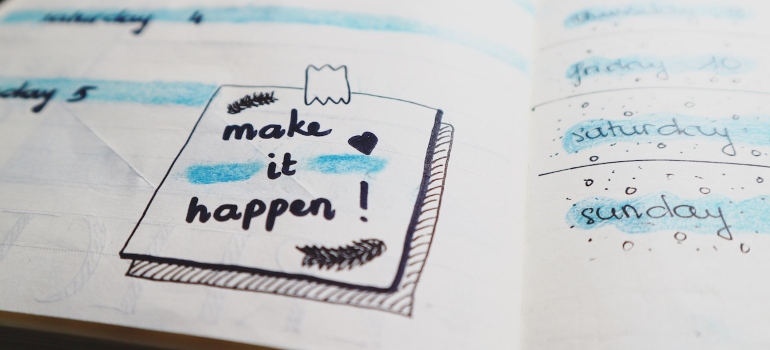 A drawing of a post-it note saying "make it happen!"