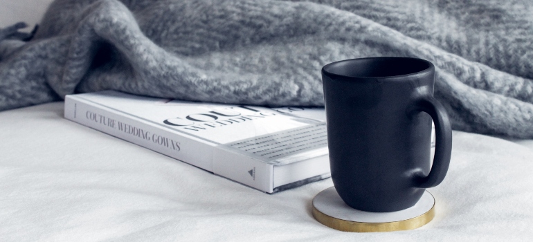 mug, book, and a blanket as a part of one of the addiction treatment programs