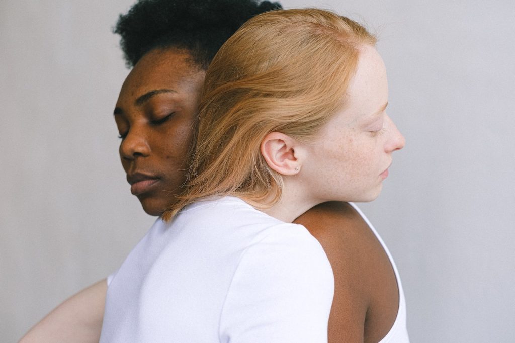 Two women hugging to symbolize ways to connect with an addicted loved one